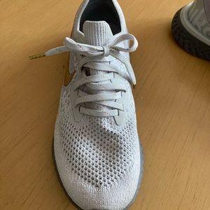 Nike epic react flyknit “vast gold” women’s sneakers